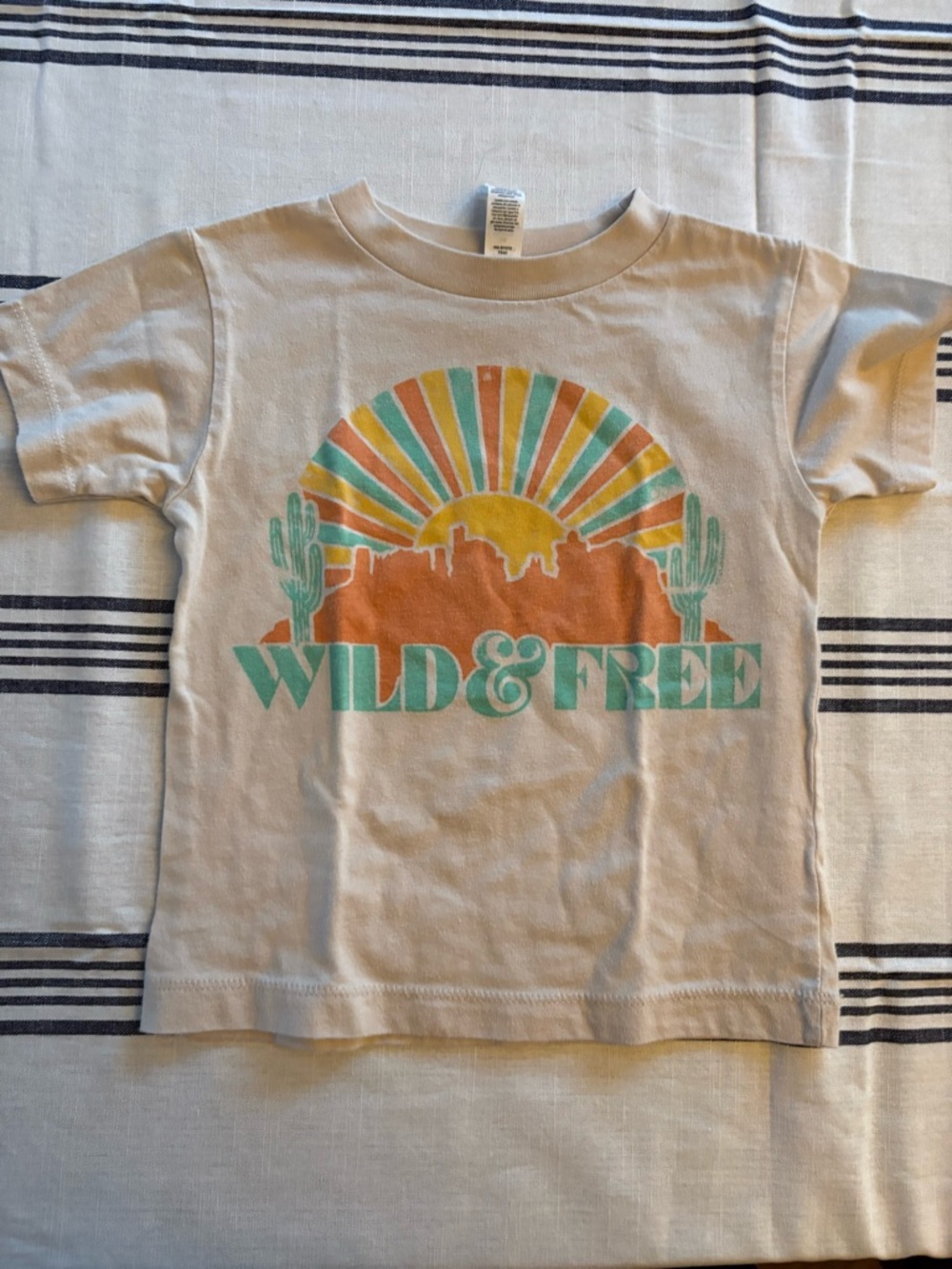 Bella Canvas Cream Kids Tee with Orange & Teal 'Wild & Free' Graphic